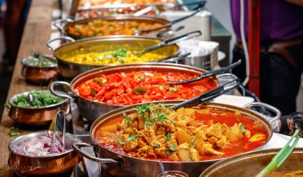 Variety-of-cooked-curries-on-display-at-Camden-Market-in-London-1200x853